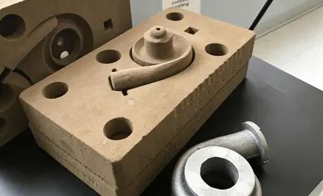 Sand casting mold and finished metal component